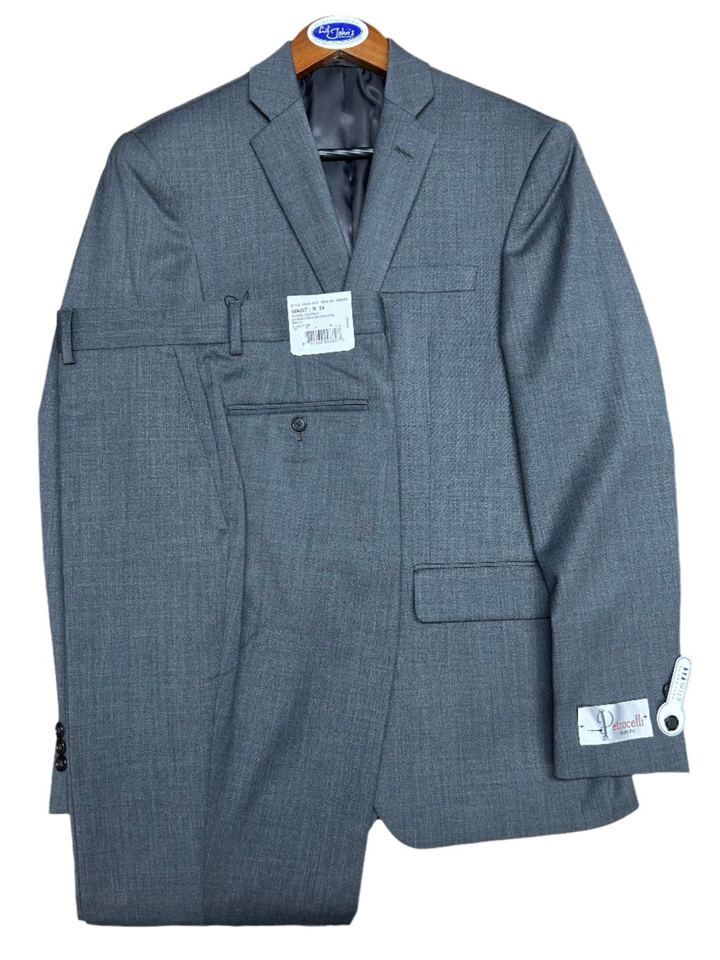 Gray suit jacket on a wooden surface with tags attached