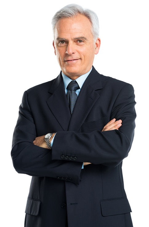 Man in a dark navy suit with arms crossed on a white background