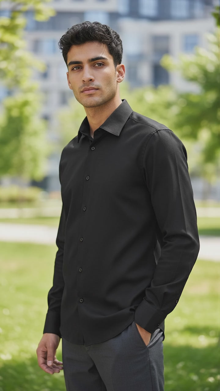man wearing a black dress shirt